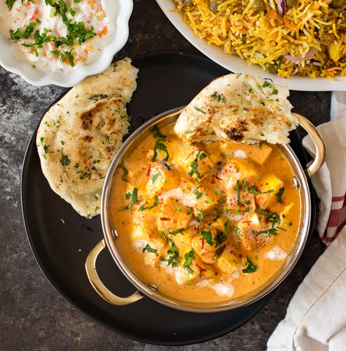 Paneer Curry served with Naan, raita and biryani