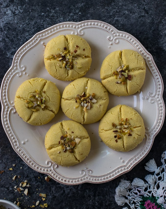 Indian cookies on a white plate.