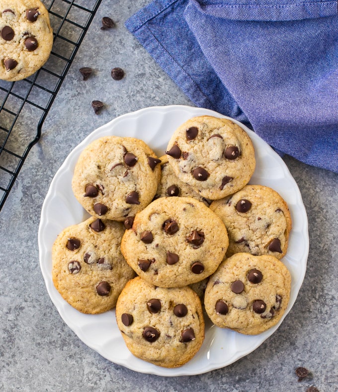 Best eggless chocolate chipe cookies on a plate with a napkin. 