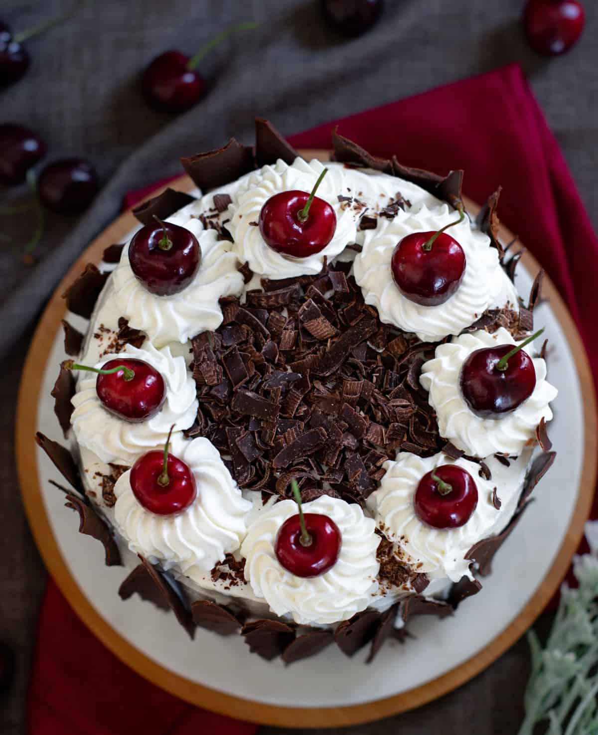 Eggless black forest cake served on dish with a red napkin