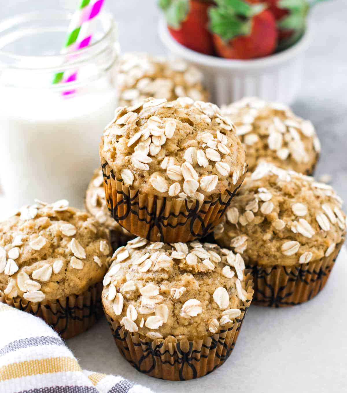 Muffins on a white serving dish served with milk 