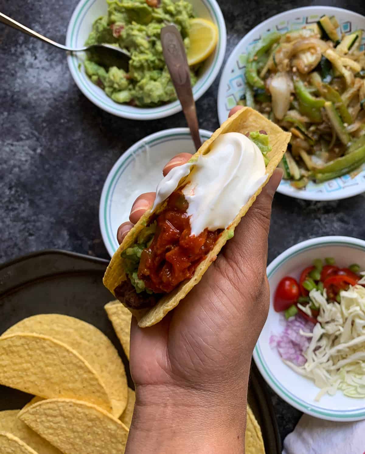 Filling taco shells with toppings