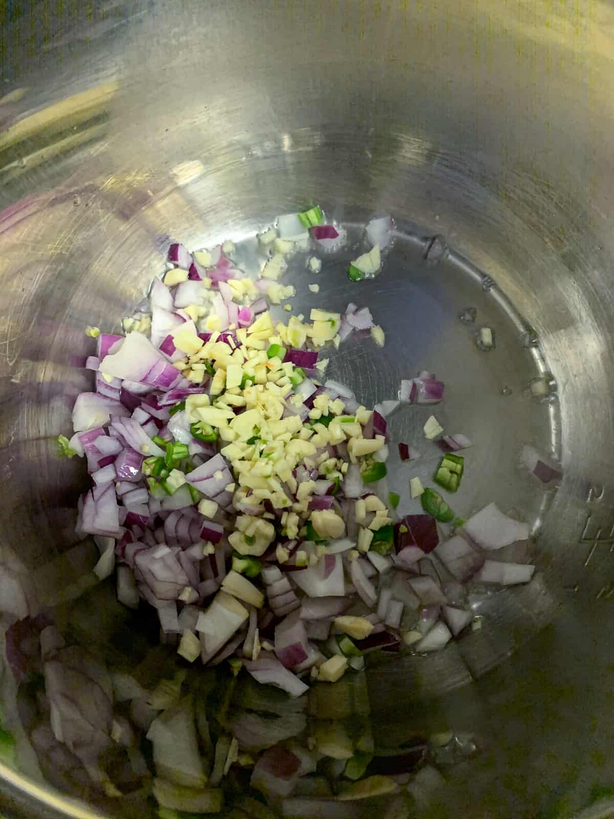 Saute garlic, onion, chilies in an Instant Pot