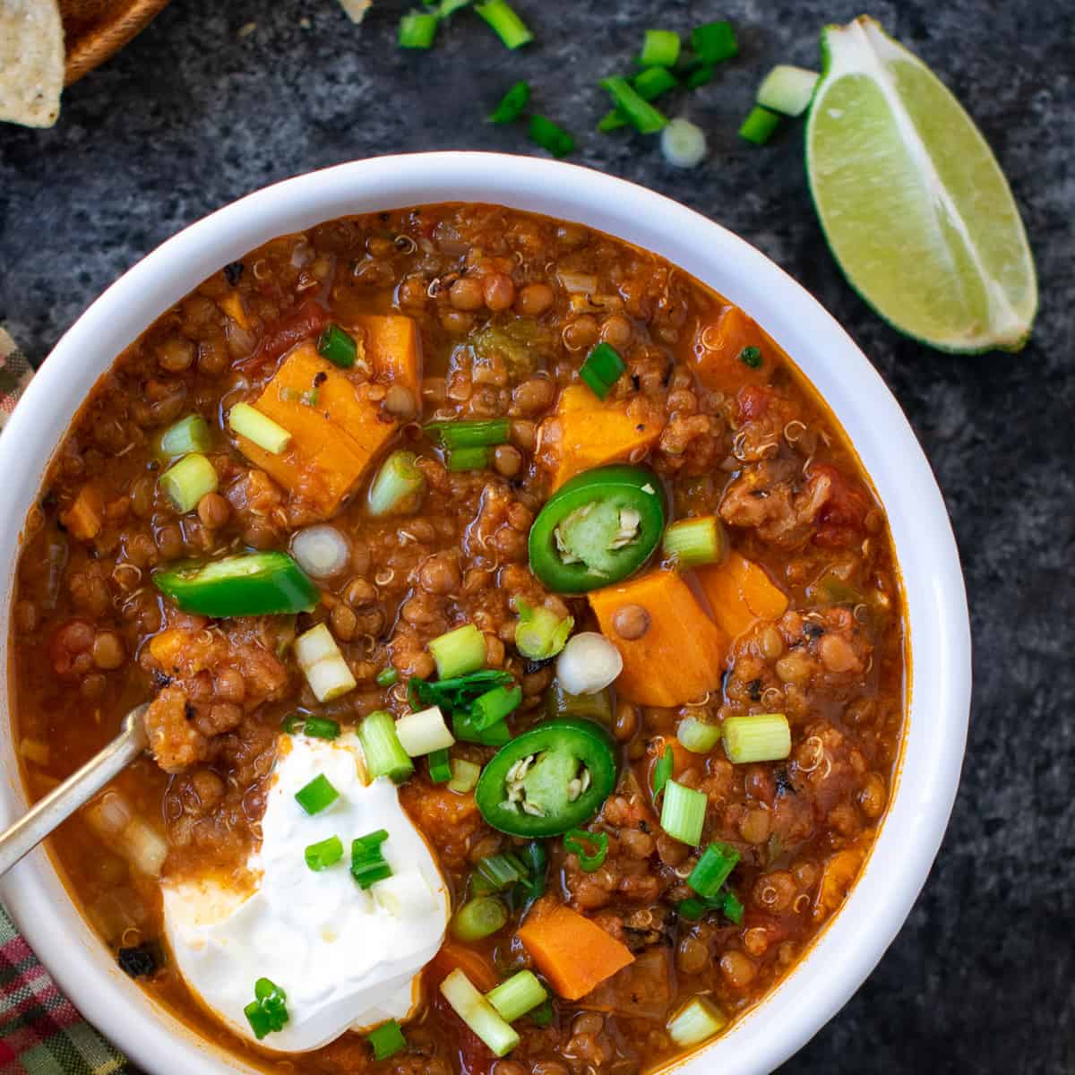 Sweet potato chili served with sour cream on top
