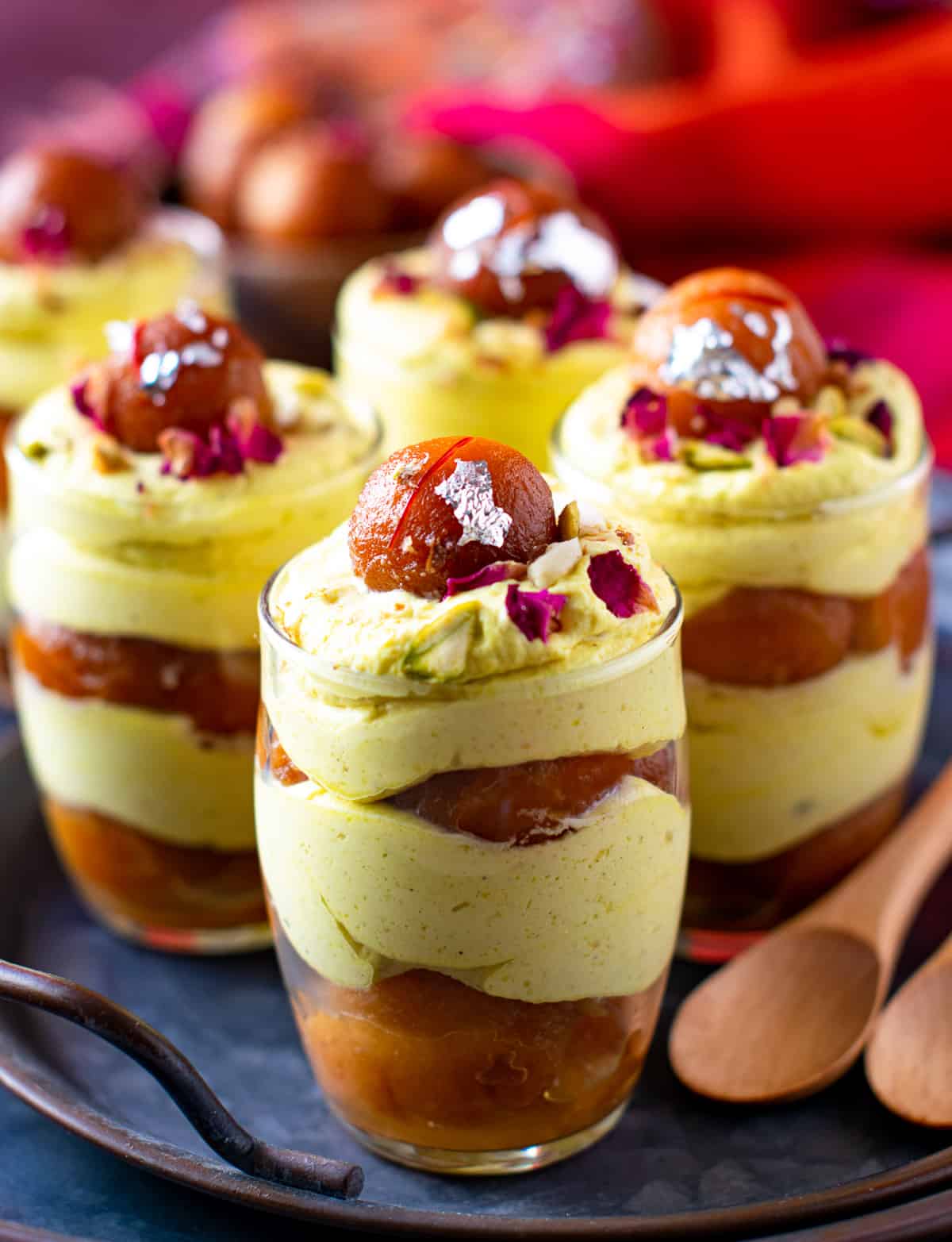 Thandai mousse layered with gulab jamun in a glass