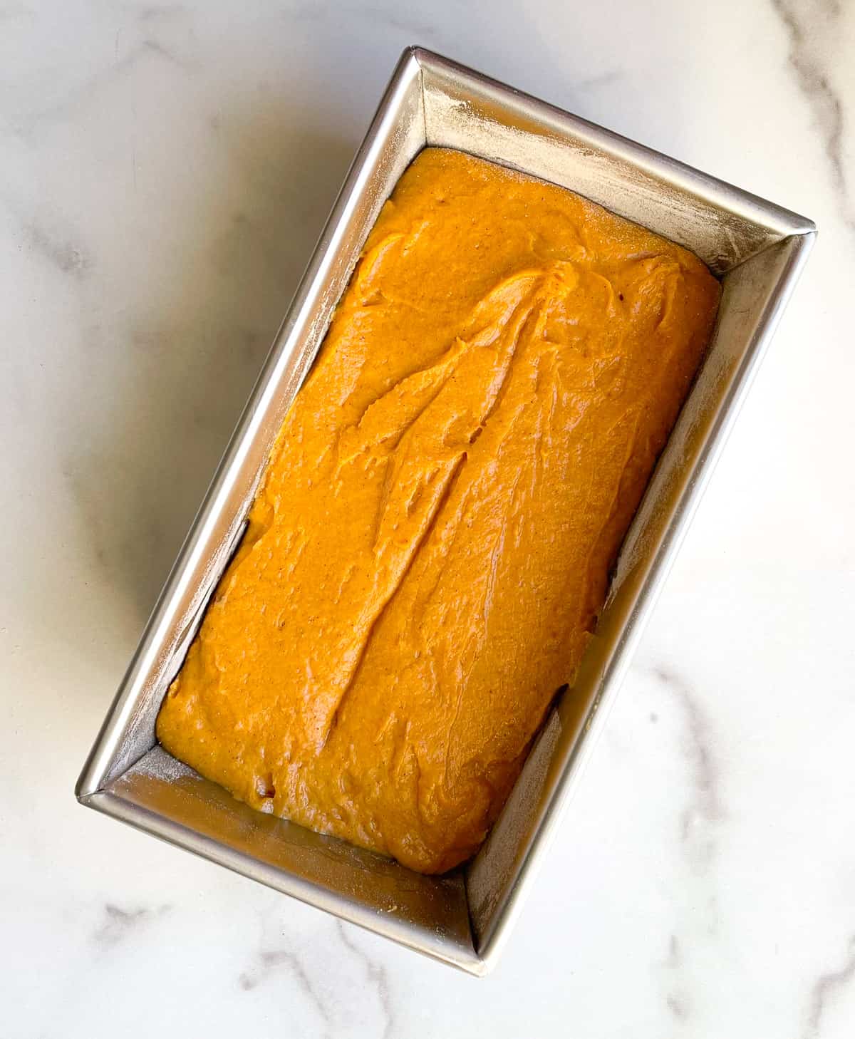 Adding batter to the loaf pan