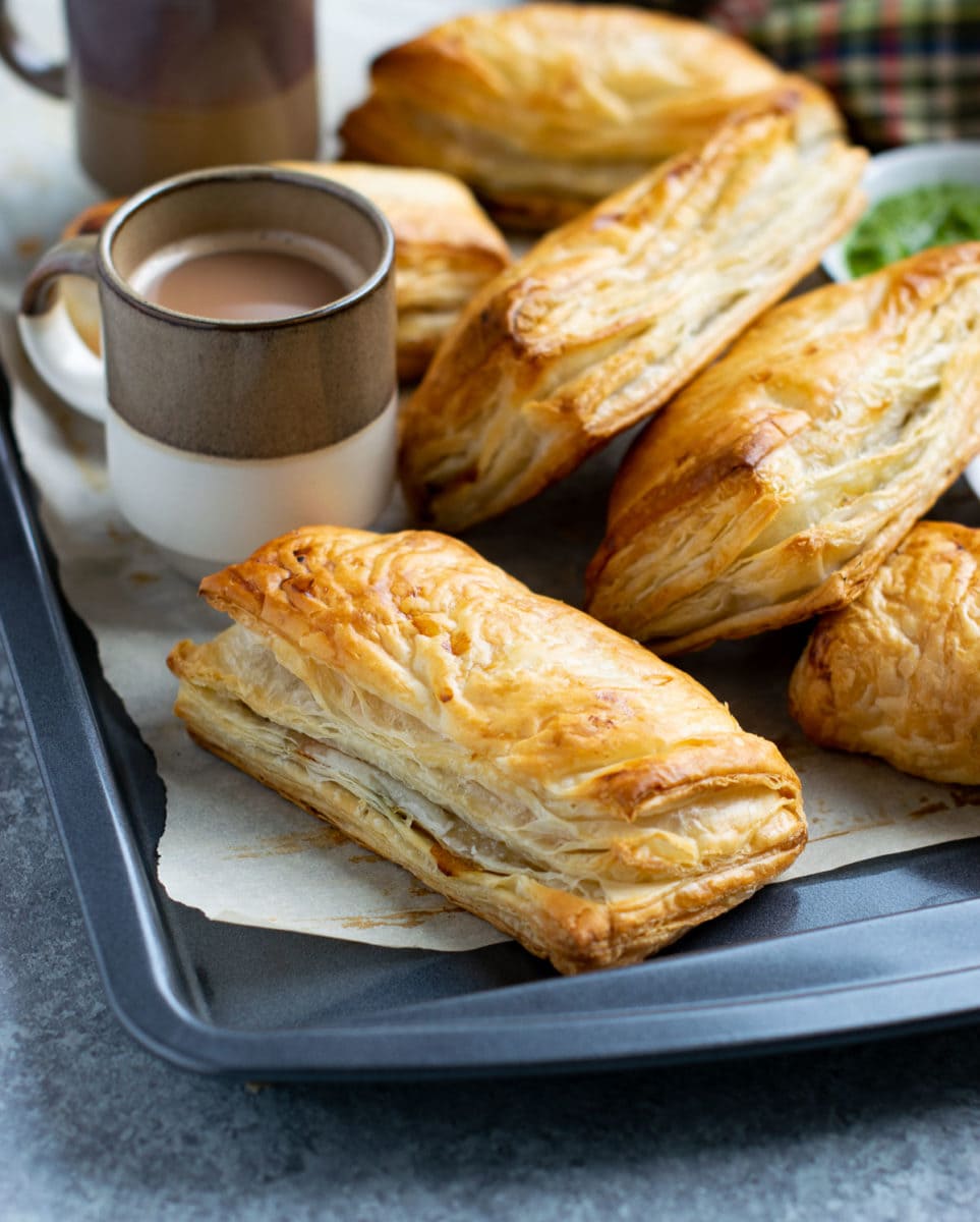 Puff pastries served with tea in a cup.