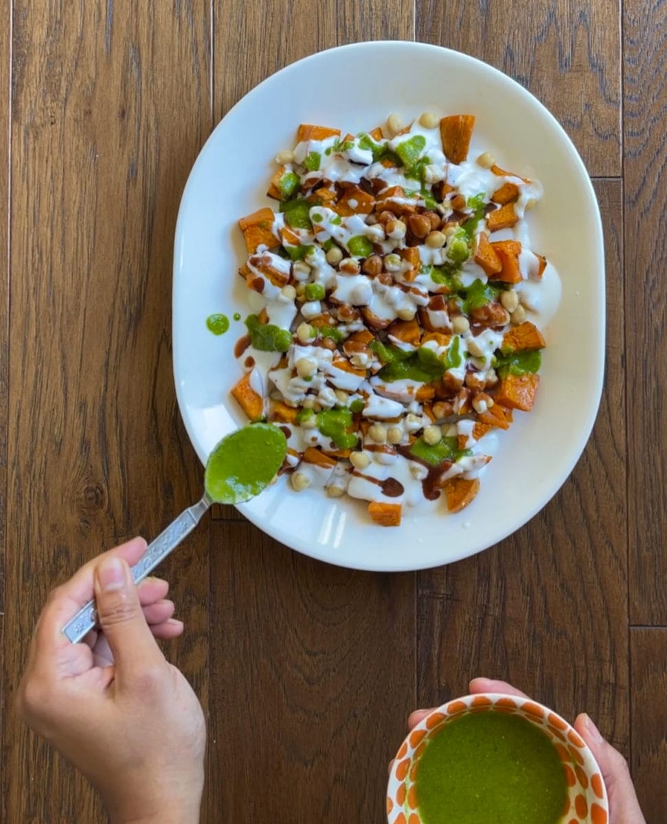 Putting chutney over the chickpea sweet potato chaat. 