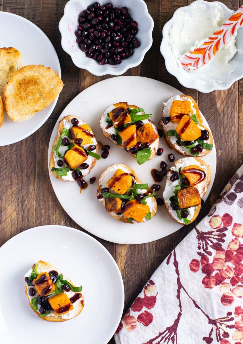 Goat cheese crostini drizzled with balsamic glaze. 