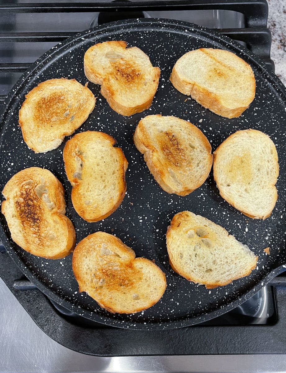 Bread placed on a skillet to toast. 