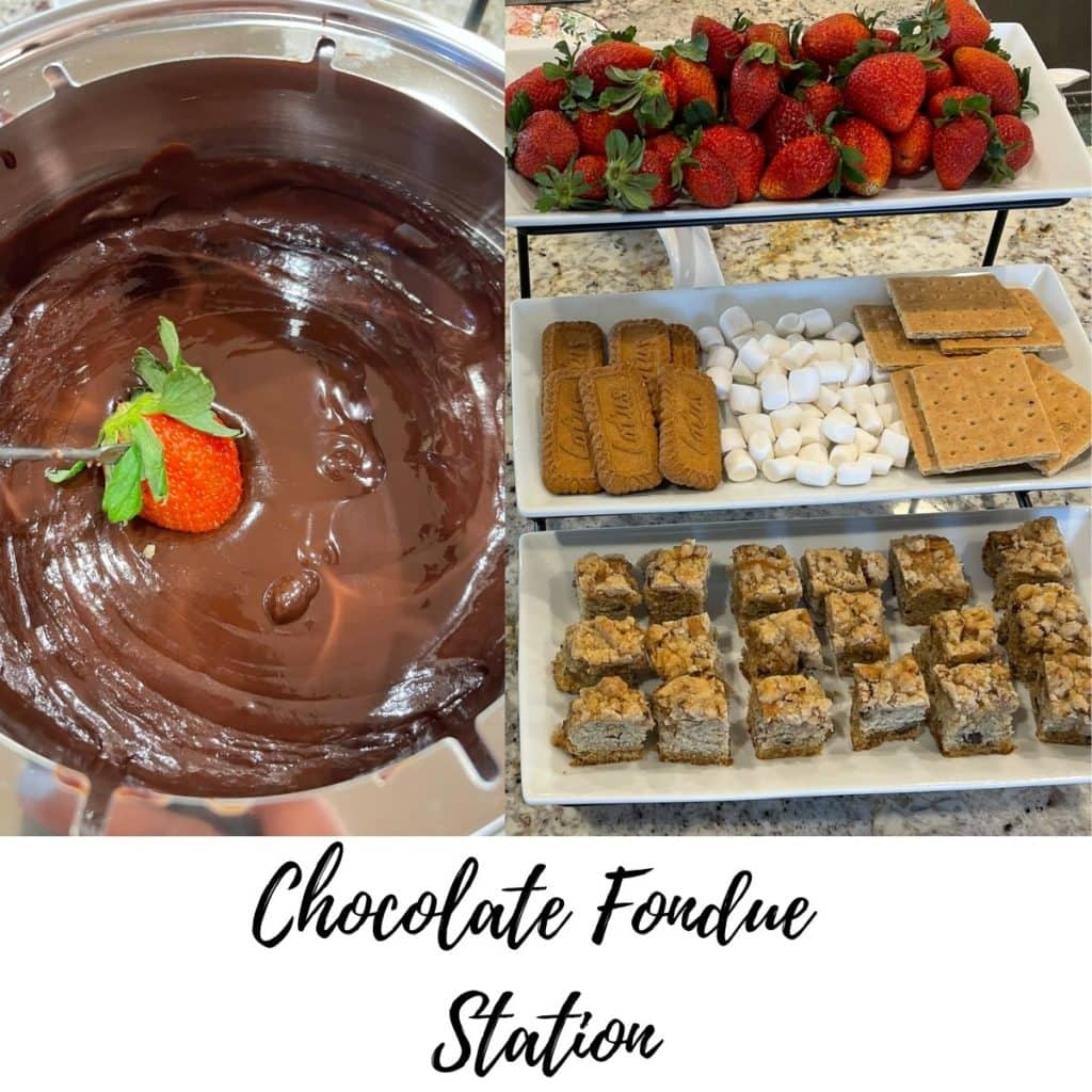 Chocolate fondue with strawberries, marshmallows, crackers and cake.