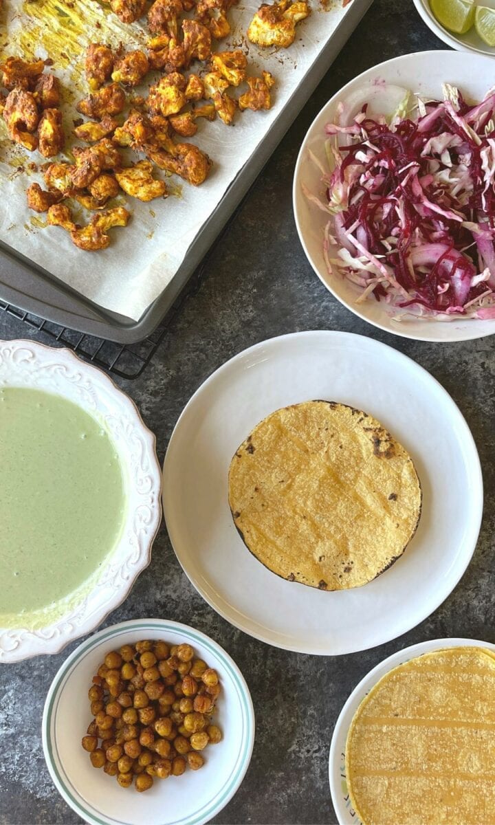 Assembling the cauliflower chickpea tacos. 